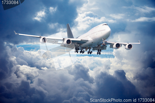 Image of Aircraft is going for landing. Against cloudy sky