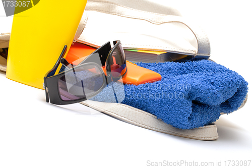 Image of Beach Bag with Towel and Bottles Cream