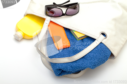 Image of Beach Bag with Towel and Bottles Cream