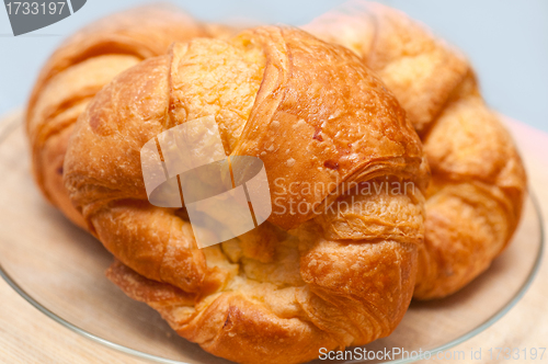 Image of fresh baked french croissant brioche on wood board