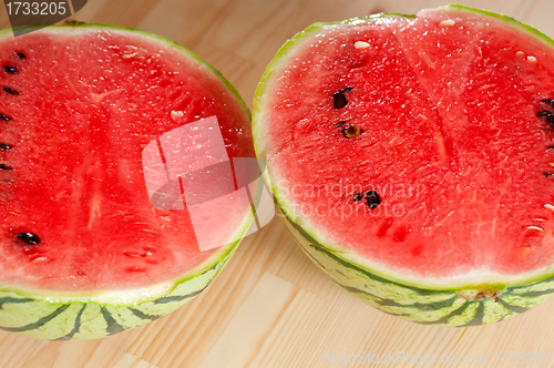 Image of fresh watermelon on a  wood table