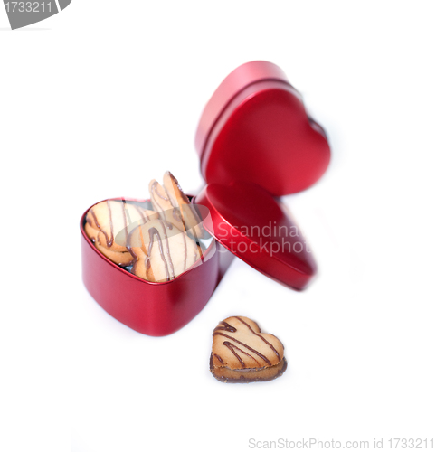 Image of heart shaped cream cookies on red heart metal box