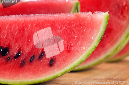 Image of fresh watermelon on a  wood table