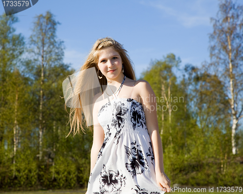 Image of Portrait of a beautiful girl in white dress with her hair