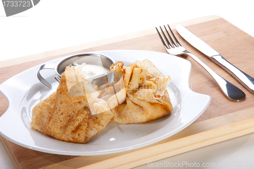 Image of rolled pancakes stuffed ham and cheese ready to eat