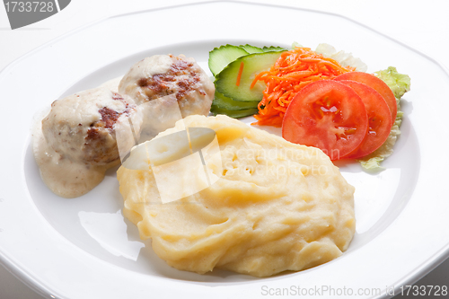 Image of meat cutlet with mashed potatoes and fresh salad