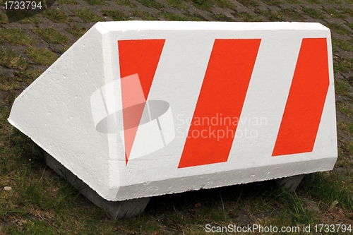 Image of warning symbol on big concrete block