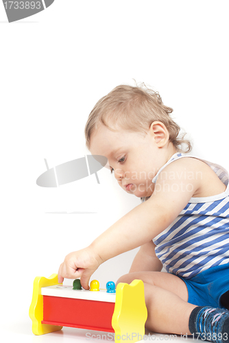 Image of boy with a toy