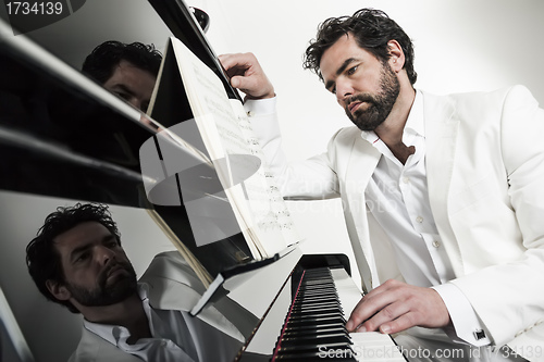 Image of man with piano