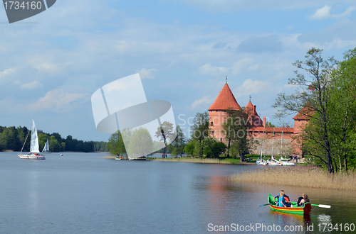 Image of People travel boat on lake Galve and Trakai Castle 