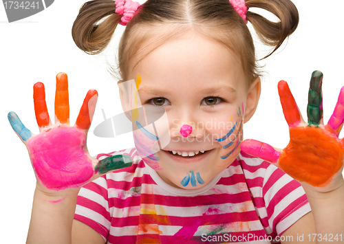 Image of Portrait of a cute girl with painted hands