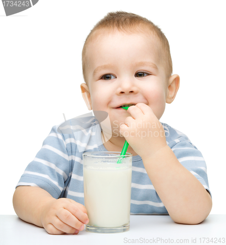 Image of Cute little boy with a glass of milk