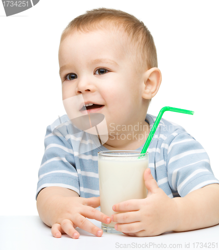Image of Cute little boy with a glass of milk