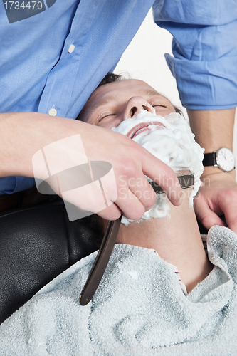 Image of Man Getting Shaved