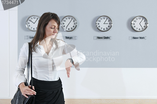 Image of Businesswoman Checking Time