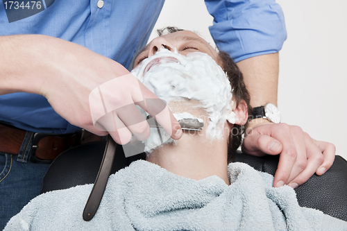 Image of Man Getting Shaved