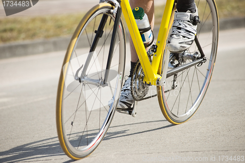 Image of Male Athlete Riding Bicycle