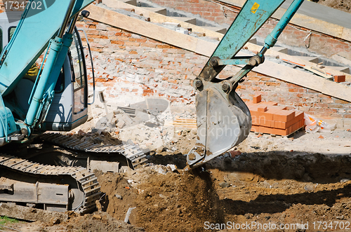 Image of operating excavator