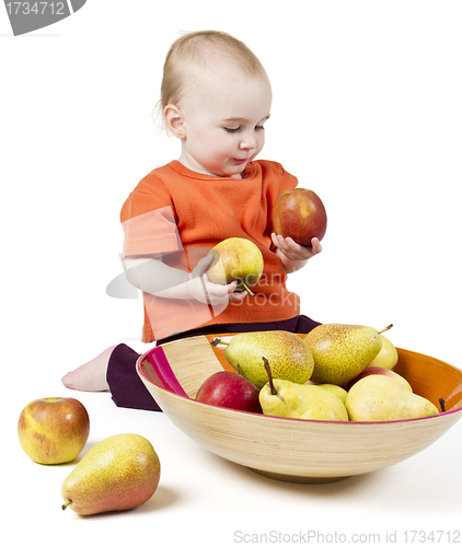 Image of baby with apples