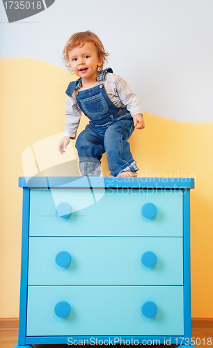 Image of Toddler jumping from furniture