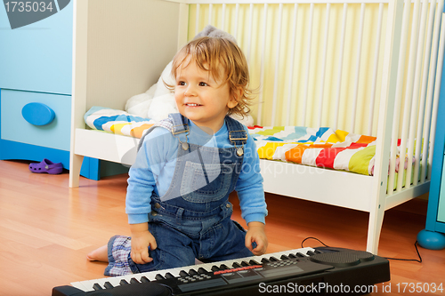 Image of Boy playing a composer