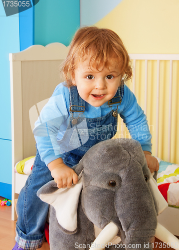 Image of Kid riding a toy elephant