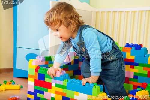 Image of Happy kid claiming out of toy block