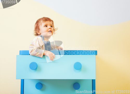 Image of Toddler sitting in the box