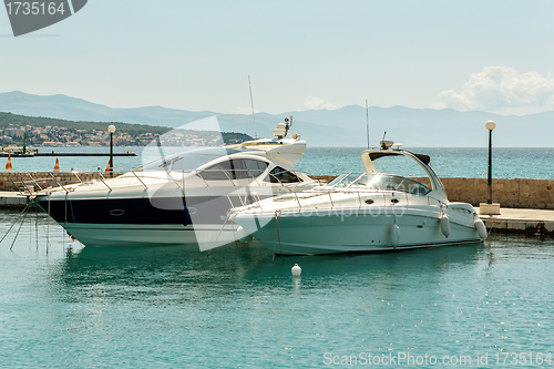 Image of two luxury yachts