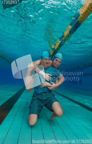 Image of Girl hug boyfriend underwater