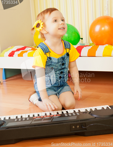 Image of Little girl playing piano