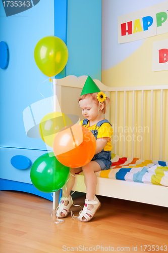 Image of Little girl with balloons