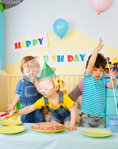 Image of Three kids having fun on the birthday party