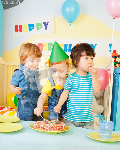 Image of Three kids eating cake on the birthday party