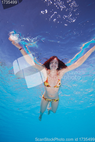 Image of Happy young woman in the water