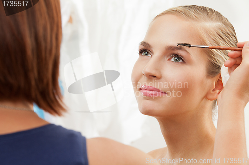 Image of Professional makeup artist working