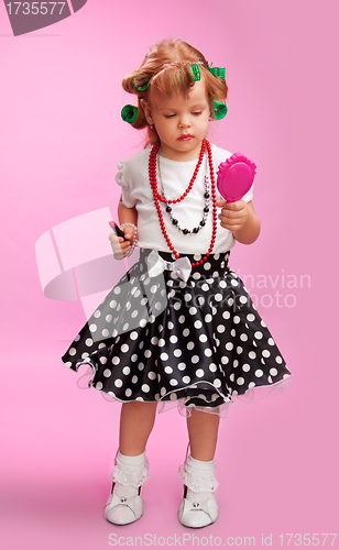 Image of Little fashion-conscious girl, just like mother