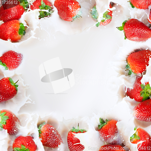 Image of Strawberries splashing into milk frame