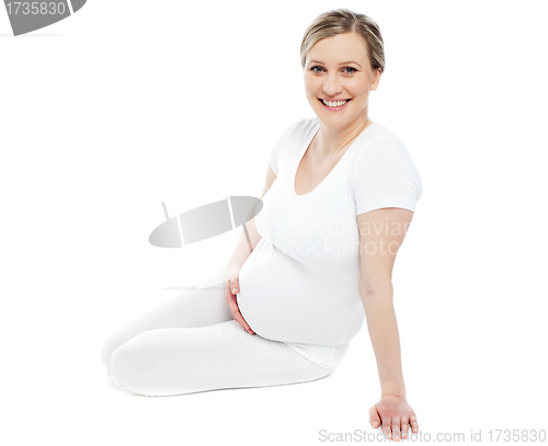 Image of Studio portrait of pregnant woman