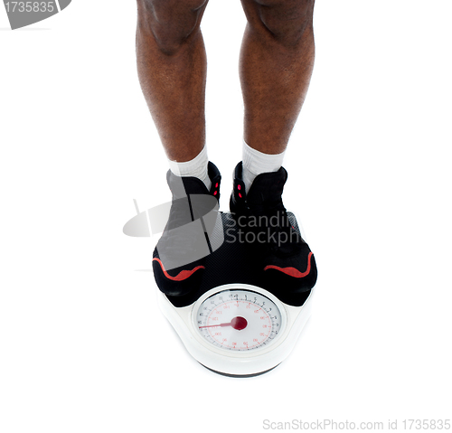 Image of Man's feet on weighing scale