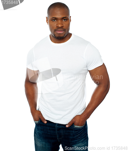 Image of Trendy muscular guy posing in style