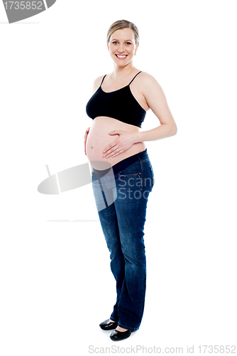 Image of Photo session in studio of pregnant woman