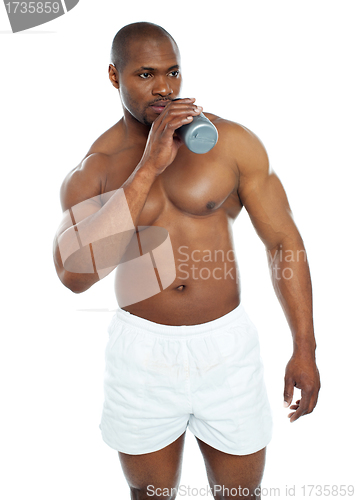 Image of Muscular male drinking health drink