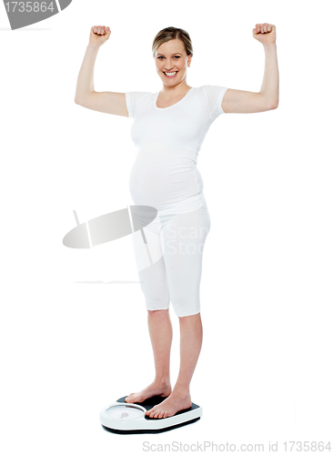 Image of Excited pretty pregnant woman