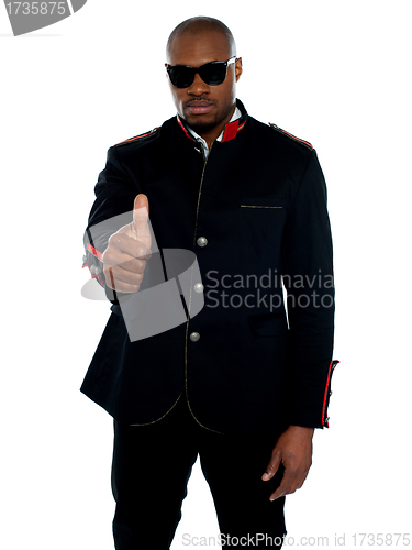 Image of Handsome african male showing thumbs-up