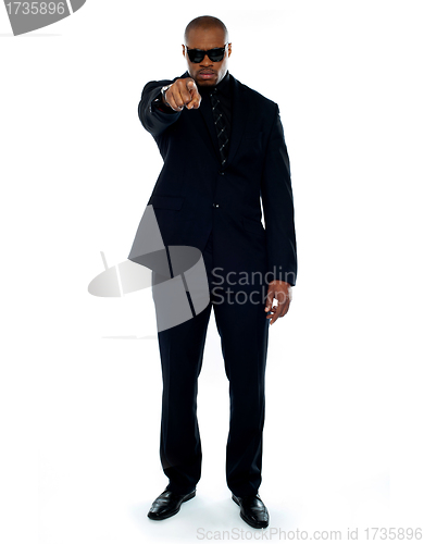 Image of Businessman pointing at you. Full-length portrait