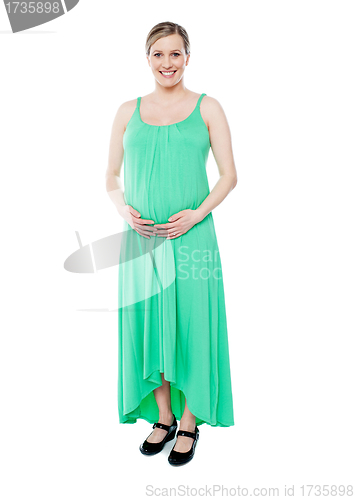 Image of Brunette pregnant woman dressed like princess