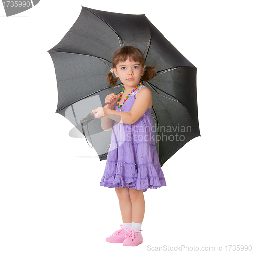 Image of Little girl with a big black umbrella