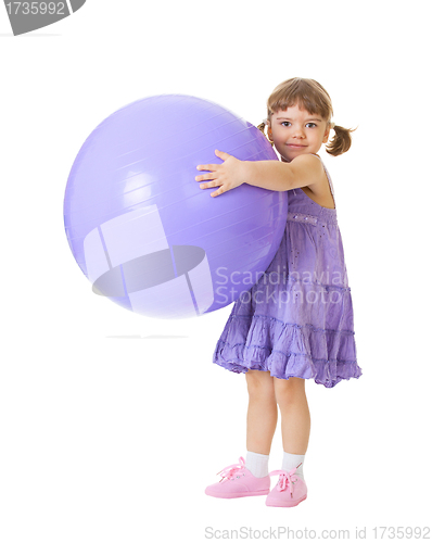 Image of Little girl with a big purple ball