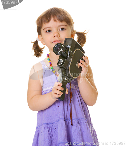 Image of Curious child with an old movie camera